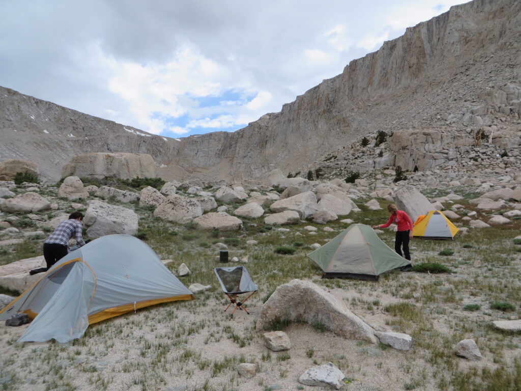 Setting up camp and hoping to dodge the weather