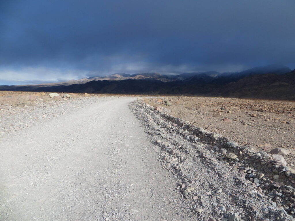 My dad took a photo of the ominous clouds hanging over Titus Canyon. This road was the starting stretch of the race and headed straight up to the canyon entrance.
